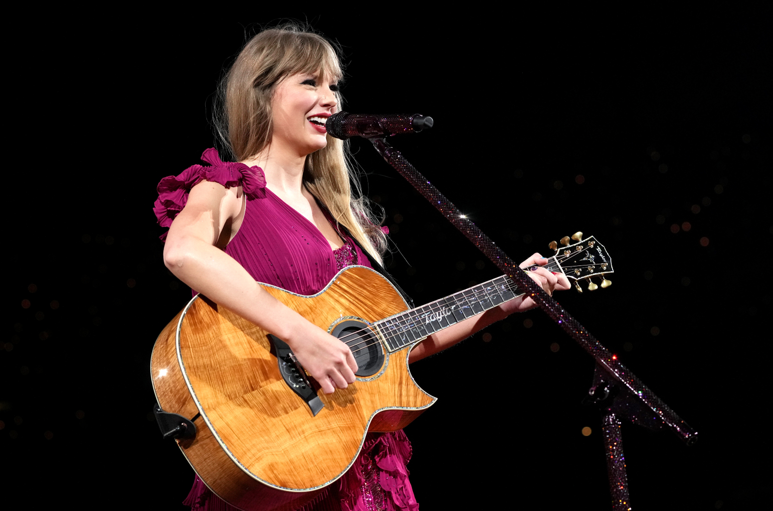 Taylor Swift with guitar at Eras tour